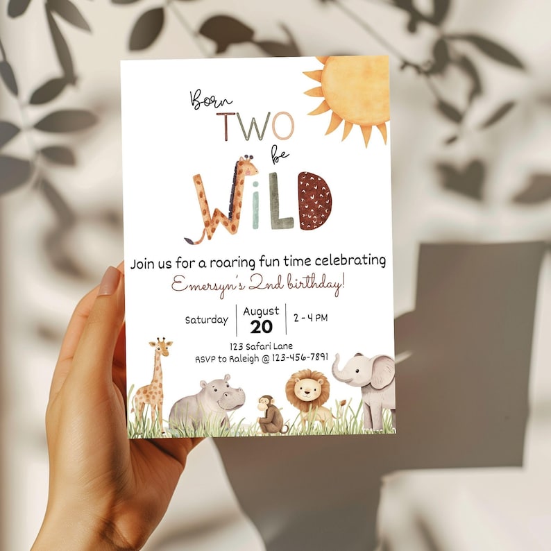 May include: A white invitation card with the text "Born Two Be Wild" and a watercolor sun illustration. The card includes details for a birthday celebration, featuring safari animals like a giraffe, hippo, monkey, lion, and elephant.