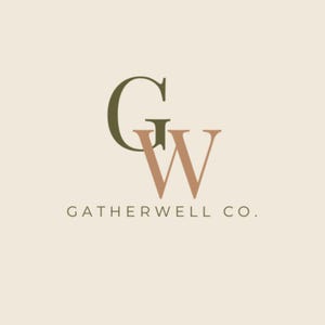 May include: Logo design featuring the letters "G" and "W" in a stylized font. The "G" is a dark olive green, and the "W" is a muted peach color. The text "GATHERWELL CO." is below the letters in a simple, sans-serif font.