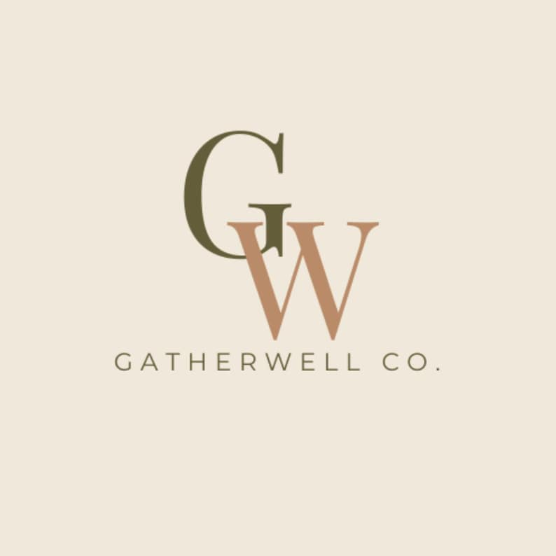 May include: Logo design featuring the letters "G" and "W" in a stylized font. The "G" is a dark olive green, and the "W" is a muted peach color. The text "GATHERWELL CO." is below the letters in a simple, sans-serif font.