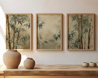 May include: Three framed bamboo art prints with a natural wood frame. The artwork features watercolor-style bamboo stalks and leaves in shades of green and brown. Two terracotta vases and three small wooden bowls sit on a wooden table.