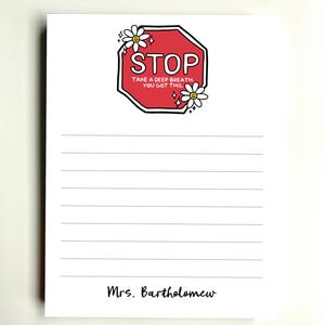 May include: A white rectangular notepad with horizontal lines. At the top, a red octagonal stop sign graphic features white daisies, sparkles, and the text "STOP TAKE A DEEP BREATH YOU GOT THIS." The name "Mrs. Bartholomew" is printed at the bottom.