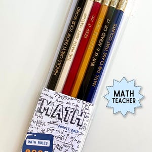 May include: A set of five pencils in a clear plastic sleeve, each featuring gold text: PENCILS ONLY! SHOW YOUR WORK!, THE MATH AIN'T MATHIN', KEEP IT 100, DON'T BE MEAN, WHY IS 6 AFRAID OF 7?, MATH, THE CLASS THAT COUNTS. Includes a MATH TEACHER label.
