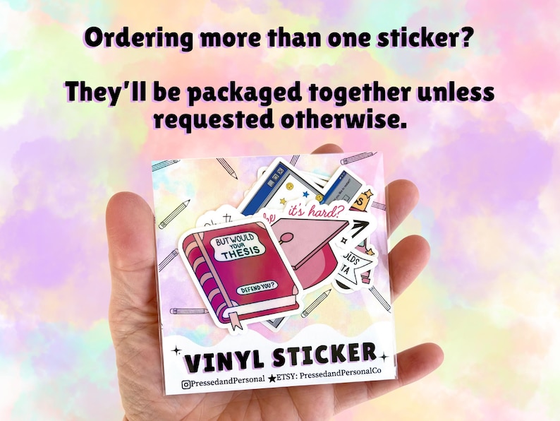 May include: A clear packet of vinyl stickers featuring academic-themed designs. The stickers include a book with the text "BUT WOULD YOUR THESIS DEFEND YOU?", a graduation cap, and other school-related graphics. The text "VINYL STICKER" is also visible.