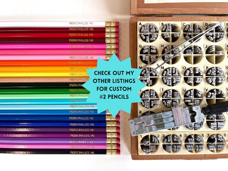 May include: A collection of colorful #2 pencils with the text "PERSONALIZE ME" printed on them. A wooden box with metal letter stamps and tools is also visible. The image includes the text "CHECK OUT MY OTHER LISTINGS FOR CUSTOM #2 PENCILS".