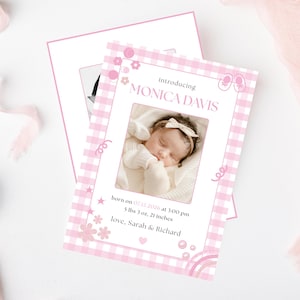 May include: A pink and white gingham baby announcement card with the text "Introducing MONICA DAVIS." The card includes a photo of a sleeping baby and details of birth: 5 lbs 3 oz, 21 inches. Decorative elements include flowers and stars.