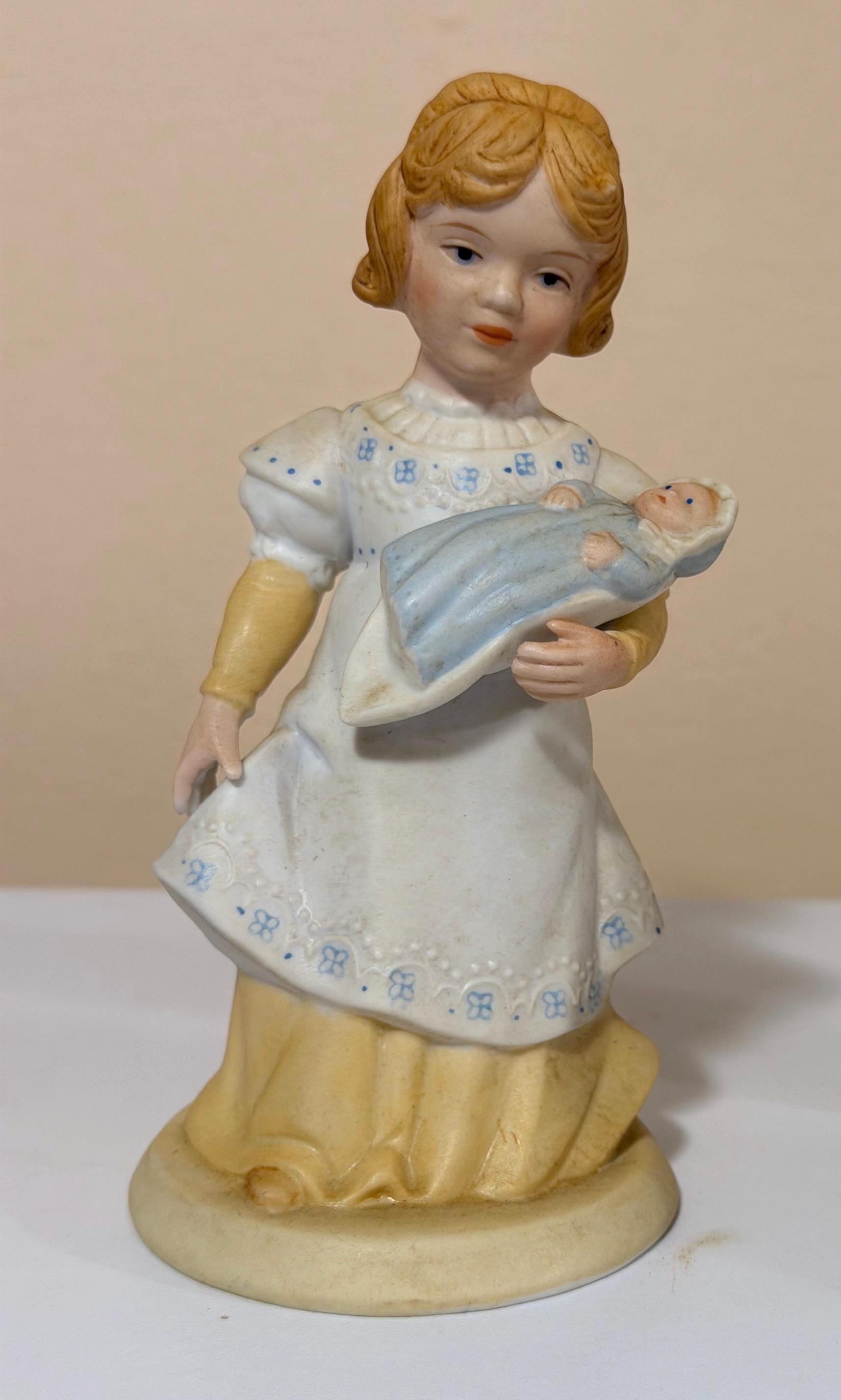 1981 Avon Porcelain Figurine – Girl Holding Baby Doll, Hand-Painted Bisque (5.5")