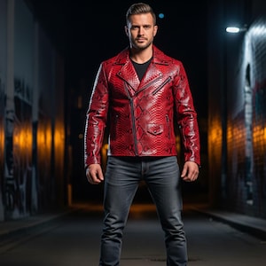 May include: A red leather jacket with a snakeskin pattern, featuring a notched collar, asymmetrical zip closure, and multiple pockets. The jacket is paired with dark wash jeans. The overall style is edgy and fashionable.