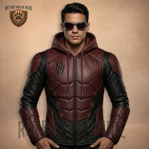 May include: A burgundy and black leather jacket with a hood and a zip fastening. The jacket has a stylized "DJ" emblem on the chest and padded shoulders. The Retro Wild Hide logo is visible in the upper left corner.