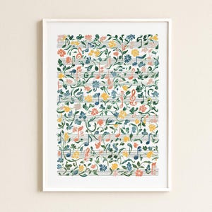 May include: A framed print featuring musical notes and floral elements. The artwork displays a white background with musical staff lines. Colorful flowers and leaves intertwine with musical symbols in shades of blue, yellow, orange, and pink.