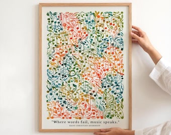 May include: A framed art print featuring a colorful watercolor design of musical notes and leaves. The artwork includes the quote "Where words fail, music speaks." by Hans Christian Anderson. The frame is made of light-colored wood.