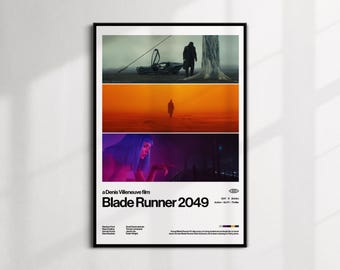 May include: A framed poster for the film "Blade Runner 2049" by Denis Villeneuve. The poster features three horizontal images from the film, with the title and credits at the bottom. The color palette includes shades of orange, blue, and gray.