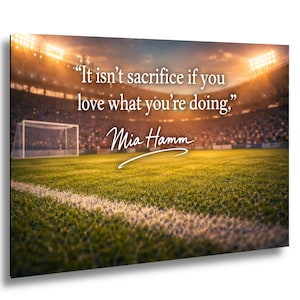 May include: A motivational wall art print featuring a soccer field with stadium lights. The quote "It isn't sacrifice if you love what you're doing," by Mia Hamm is displayed in white text.