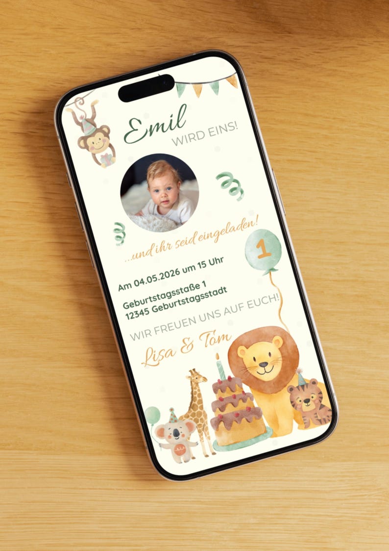 May include: A smartphone displays a birthday invitation with the text "Emil wird eins!" and a photo of a baby. The design includes a monkey, a lion, a giraffe, and a cake. The invitation is for a party on May 4, 2026.