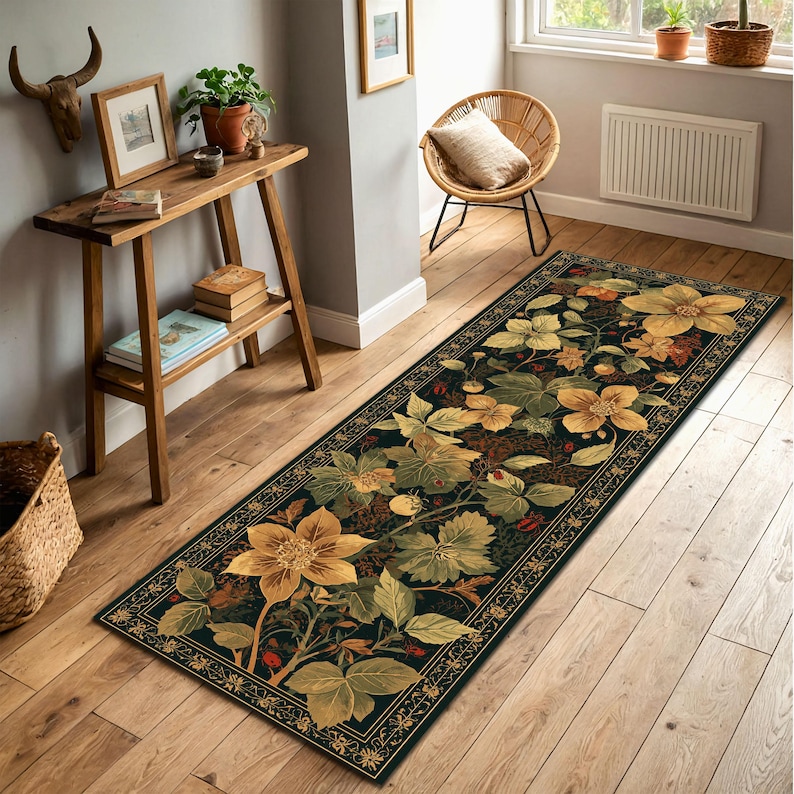 May include: A long, rectangular rug with a floral design. It features large yellow flowers, green leaves, and red berries on a dark background. The border has a decorative gold pattern. The rug is placed on a wooden floor.
