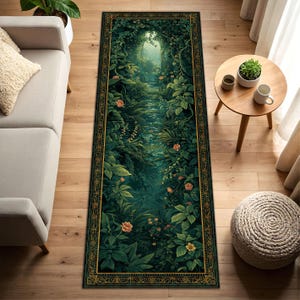 May include: A rectangular rug with a detailed forest scene in shades of green, with a gold border. The design features lush foliage, a pathway, and soft lighting, creating a serene and natural aesthetic.