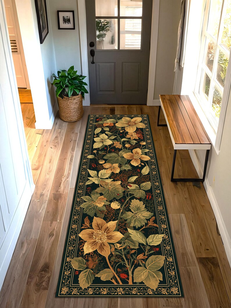 May include: A long, rectangular floral rug with a dark background and a detailed botanical design. The rug features large, stylized yellow and green flowers, leaves, and berries. A decorative border frames the floral pattern, adding a touch of elegance to the hallway.