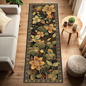 May include: A rectangular floral rug with a dark green background and a detailed border. The rug features large yellow and green flowers, leaves, and berries. The rug is placed on a wooden floor.