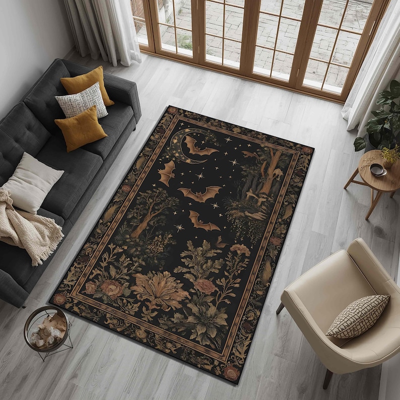 May include: A rectangular area rug with a dark background featuring bats, stars, and floral elements. The rug has a detailed border and is placed in a living room setting with a sofa and chair.