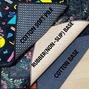 May include: A close-up of several rugs with different designs and textures. One rug features a black background with colorful geometric shapes. The underside of the rugs reveals a cotton soft pile, a rubber non-slip base, and a cotton base.