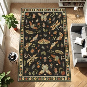 May include: A rectangular rug with a dark background, patterned with insects and flowers. The design includes butterflies, beetles, dragonflies, and flowers in orange, yellow, and green. The rug is framed by a decorative border.