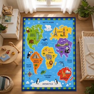 May include: A rectangular area rug featuring a colorful world map with labeled continents and oceans. The design includes illustrations of animals and landmarks such as the Statue of Liberty, Eiffel Tower, pyramids, and kangaroos on a blue background.
