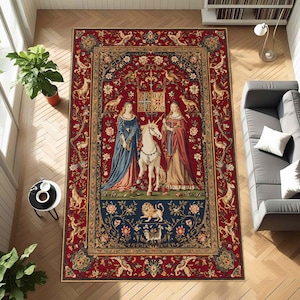 May include: A rectangular area rug with a medieval tapestry design. The rug features a red background with a central image of two women, a unicorn, and heraldic symbols. The border is adorned with floral and animal motifs.