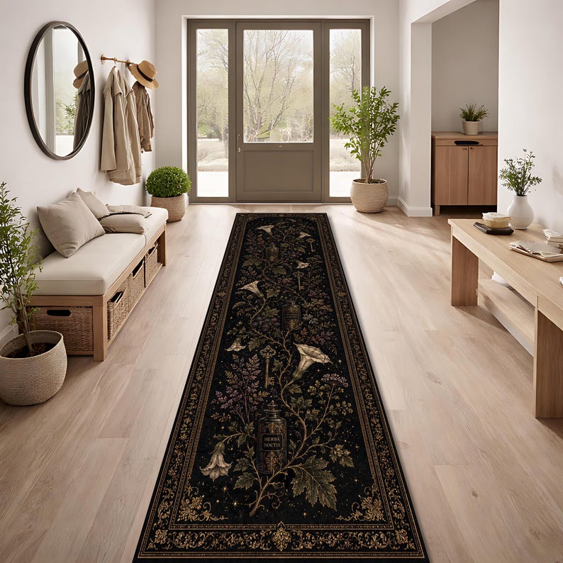 May include: A long rectangular runner rug featuring a black background with a botanical pattern of white flowers, green leaves, vintage keys, and glass apothecary bottles labeled Herba Noctis, framed by an ornate gold-toned decorative border.