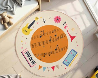 May include: A round rug with a musical theme. The rug features a large orange circle with musical notes, surrounded by illustrations of a yellow guitar, a pink piano, a red trumpet, and other musical elements. The rug is beige with colorful accents.