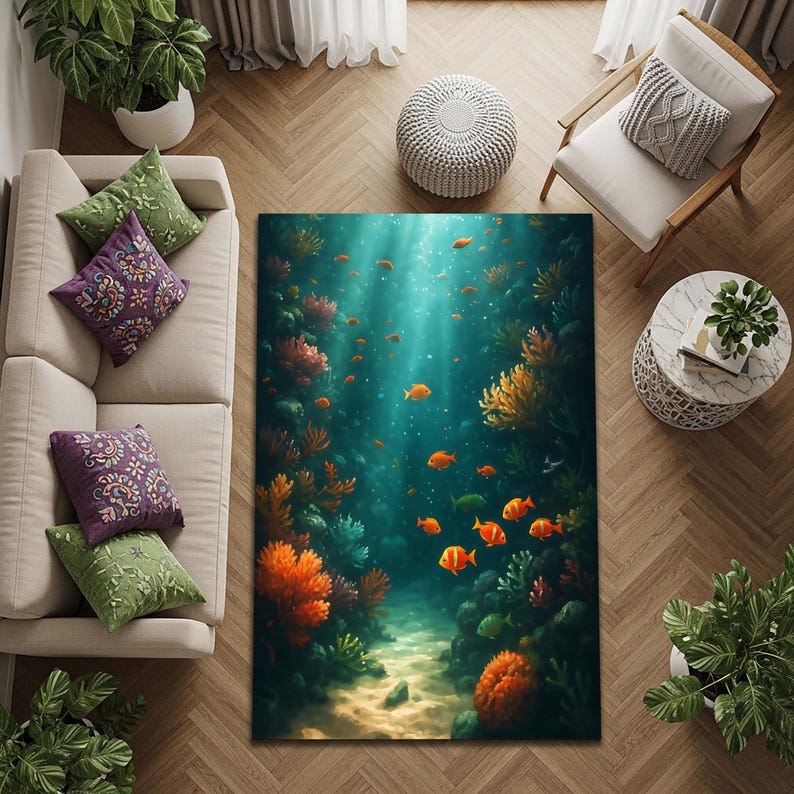 May include: A rectangular area rug featuring an underwater scene with orange and yellow coral, schools of orange fish, and a sandy seabed. The rug has a teal and blue background, creating a vibrant and immersive design. The rug is surrounded by a beige sofa, pillows, and wooden furniture.