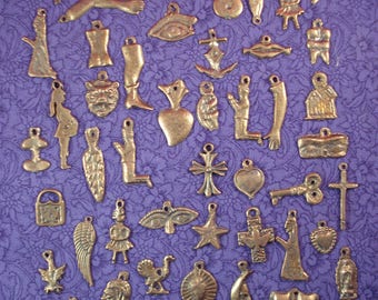 MIlagros 100 Assorted Antiqued Gold Tone Mexican Milagros Charms Ex Votos  Offerings Wholesale 1/2 inch to 1 1/4 inches.