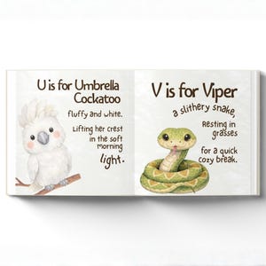 May include: An open children's book showing a white cockatoo and a green viper. The text reads "U is for Umbrella Cockatoo" and "V is for Viper". The illustrations are in a watercolour style.