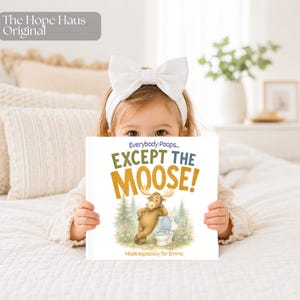 May include: A square children's book titled Everybody Poops... EXCEPT THE MOOSE! featuring an illustration of a brown moose leaning against a white toilet in a forest setting. The text Made especially for Emma is printed at the bottom of the cover.