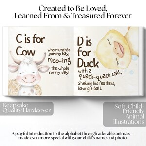 May include: Open book with colourful illustrations. One page shows a cow with the text "C is for Cow". The opposite page shows a duck with the text "D is for Duck". The book is described as a "Keepsake Quality Hardcover".