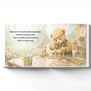 May include: A children's book illustration featuring a teddy bear wearing a yellow hard hat and overalls, building a wooden structure. The image includes text: "Right now I'm small and learning things..." A cup of tea and tools are on the table.