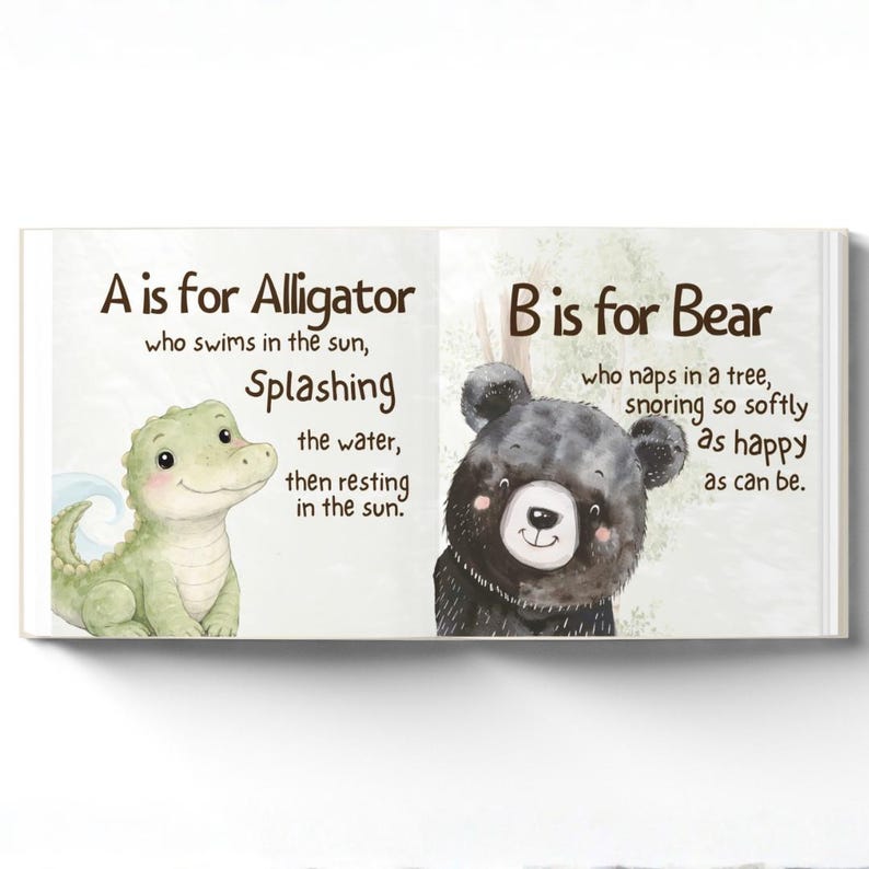 May include: An open children's book with illustrations of an alligator and a bear. The left page reads "A is for Alligator" and shows a green alligator. The right page reads "B is for Bear" and shows a black bear. The background is light green.