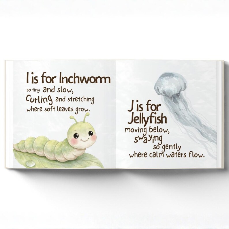 May include: An open children's book showing two pages. One page has a green inchworm illustration with the text "I is for Inchworm." The other page shows a jellyfish with the text "J is for Jellyfish."