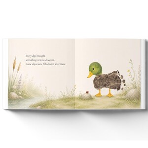 May include: An open children's book page featuring a watercolor illustration of a duckling with a textured brown body and green head standing near a small ladybug on a rock. The text reads: Every day brought something new to discover. Some days were filled with adventure.