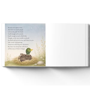 May include: An open children's book page featuring a watercolor illustration of a small duckling resting in a straw nest. The text reads: Because once upon a time, this duck was small enough to fit in the palm of a hand. Small enough to be carried.