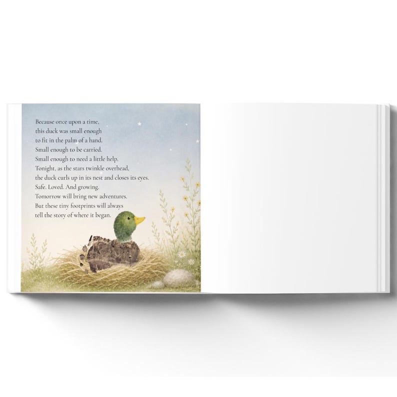 May include: An open children's book page featuring a watercolor illustration of a small duckling resting in a straw nest. The text reads: Because once upon a time, this duck was small enough to fit in the palm of a hand. Small enough to be carried.