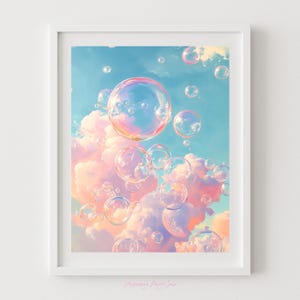 May include: A framed art print featuring a whimsical scene of floating bubbles against a backdrop of fluffy pink and white clouds and a light blue sky. The bubbles are iridescent, reflecting colors.