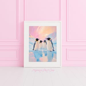 May include: A framed print featuring four penguins standing on a reflective surface, with a backdrop of a colorful sky and snow-covered mountains. The penguins have black heads, yellow accents, and white bodies. The print is in a white frame.
