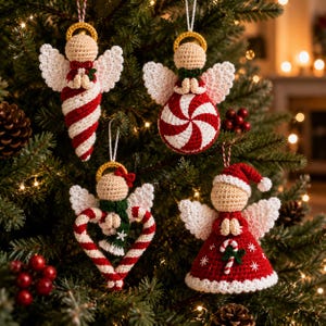 May include: Four handmade crochet angel ornaments featuring beige heads, gold halos, and white wings. One is a red and white striped cone, one is a peppermint swirl sphere, one is a heart-shaped candy cane, and one is a red dress with a candy cane.