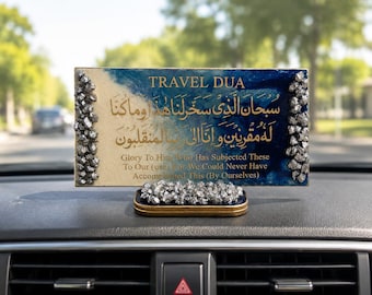 Puede incluir: Una placa rectangular con acabado de resina azul y crema, con caligrafía árabe dorada y el texto en inglés TRAVEL DUA y Glory To Him Who Has Subjected These To Our use For We Could Never Have Accomplished This By Ourselves.