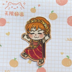 May include: A sticker featuring a cartoon character in a Roman-style outfit with a laurel wreath. The character has orange hair and is wearing a red and gold dress. The background is a light pink grid with orange fruit illustrations and Chinese text.
