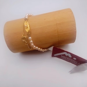 Vintage Majorcan pearl bracelet, 4 millimeters in diameter, with a gold-plated safety chain, by the Spanish brand Madreperla.