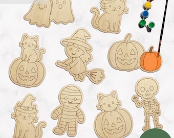 May include: A collection of light-colored wooden Halloween-themed cutouts including ghosts, cats in witch hats, a witch on a broom, pumpkins, a mummy, and a skeleton. A small paintbrush and a strip of five paint pots are included in the set.