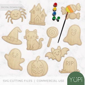 May include: A collection of unfinished wooden Halloween-themed cutouts, including a spider, haunted house, witch's hat, cat, lollipop, ghost, bat, pumpkin, and tombstone. Paint and a paintbrush are also included. The words "DIGITAL DOWNLOAD" and "SVG CUTTING FILES | COMMERCIAL USE" are visible.