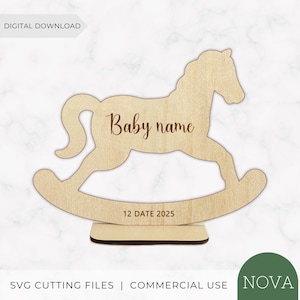 May include: A light-colored wooden rocking horse cutout on a rectangular base. The horse features the text Baby name in a script font on its body and the text 12 DATE 2025 on the curved rocker base. The design is a digital download file.