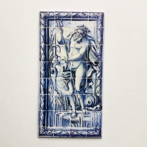 May include: A blue and white tile depicting a mythical figure holding a trident. The figure is standing on a platform with water flowing around it. The tile is framed in a blue and white border.