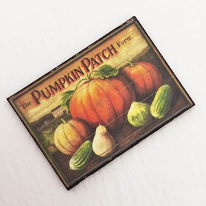 May include: A vintage-style sign with the text "The Pumpkin Patch Farm" in brown lettering on a yellow background. The sign features a still life of pumpkins and gourds in shades of orange, green, and yellow.